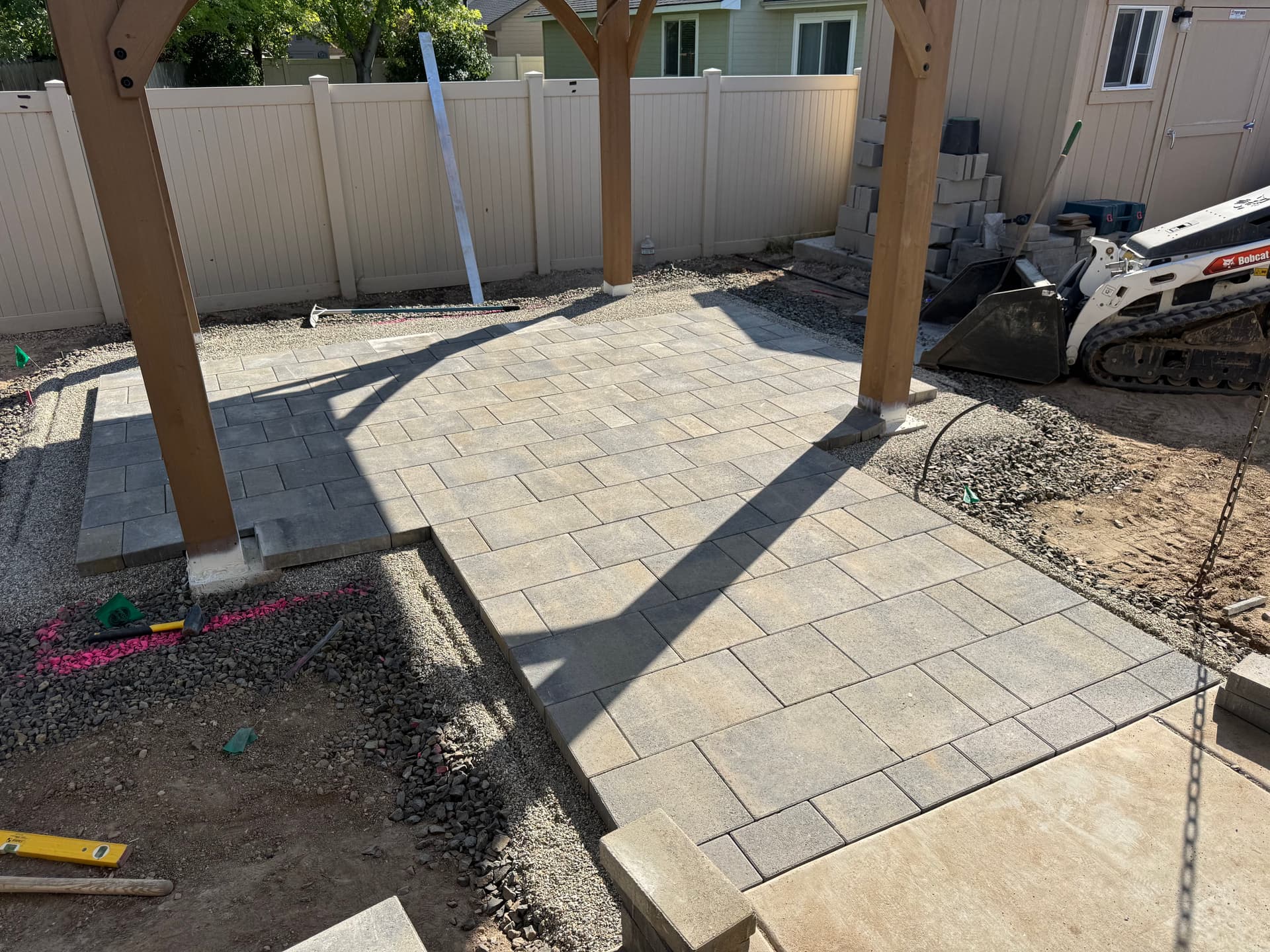 Creating Backyard Bliss with Versatile Pavers and Pergolas